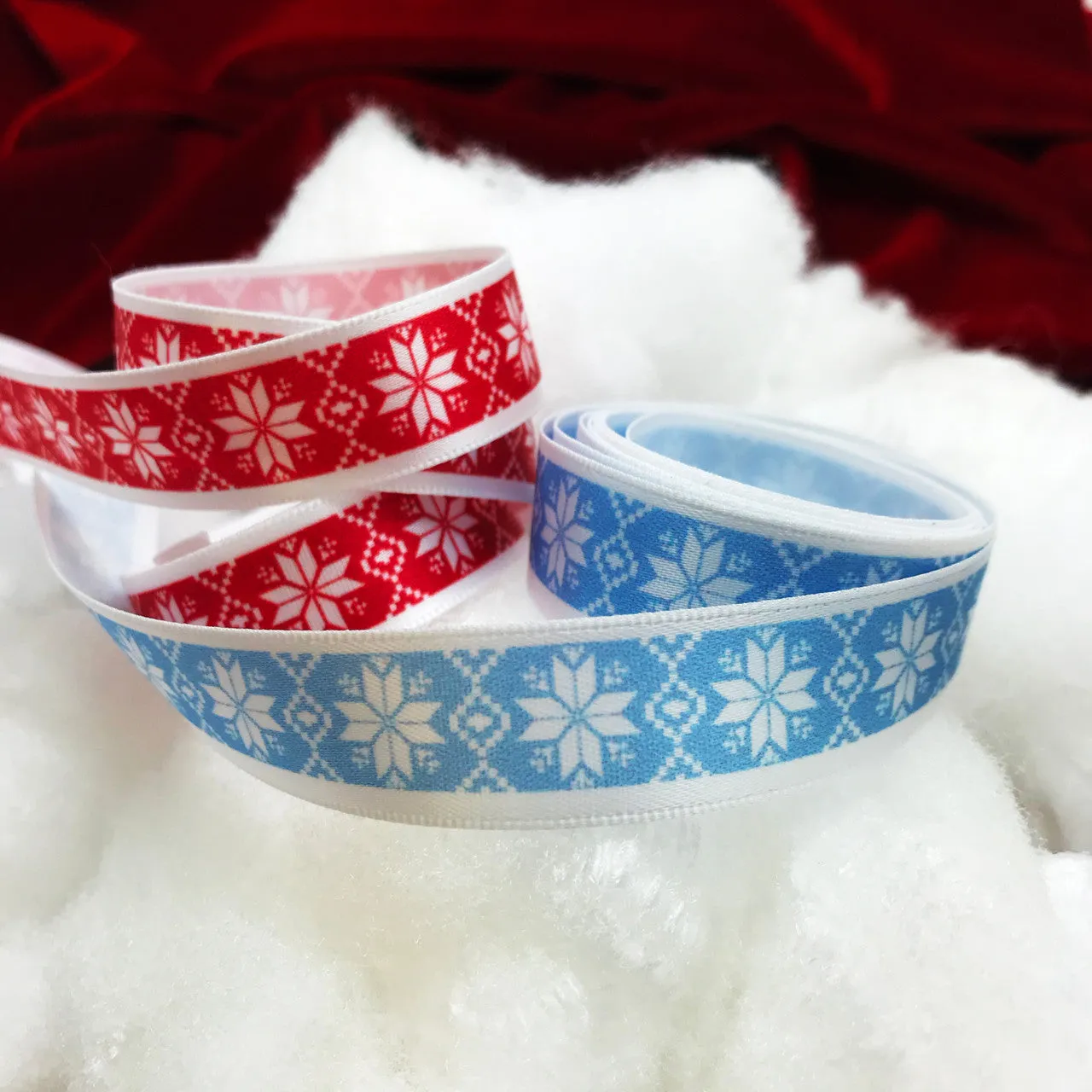 Nordic Design snowflake ribbon on a red background printed on 5/8" white single face satin